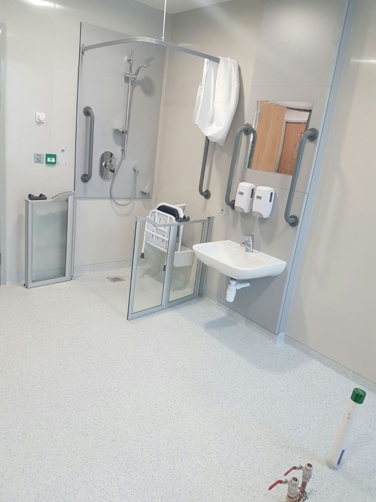 Wide expanse of epoxy decorative flake flooring in hospital