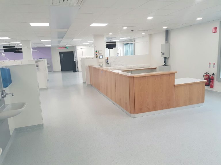 Hospital reception with epoxy decorative flake flooring in public areas