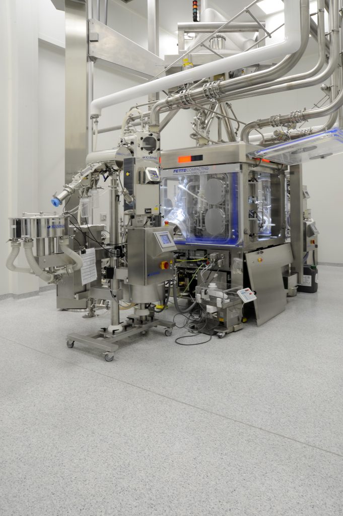 Large-scale decorative flake flooring installation in pharma facility