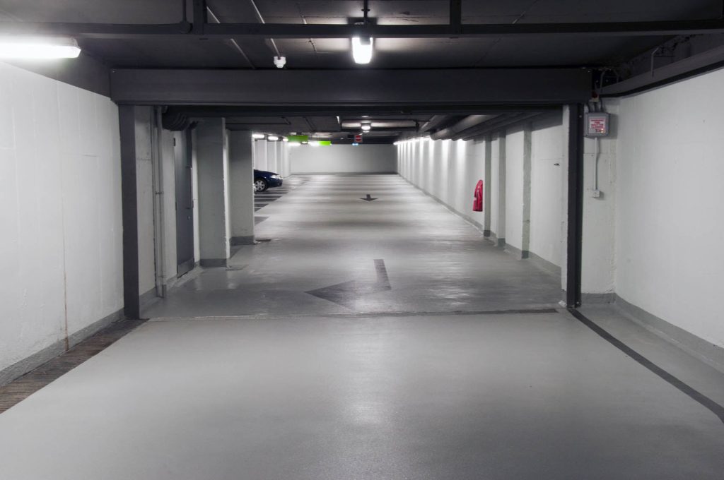 Concrete repair and epoxy flooring in basement