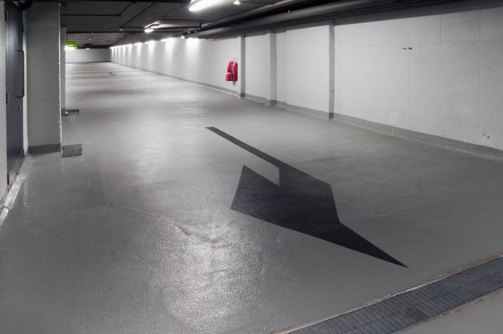 Bright, modern epoxy flooring in renovated basement