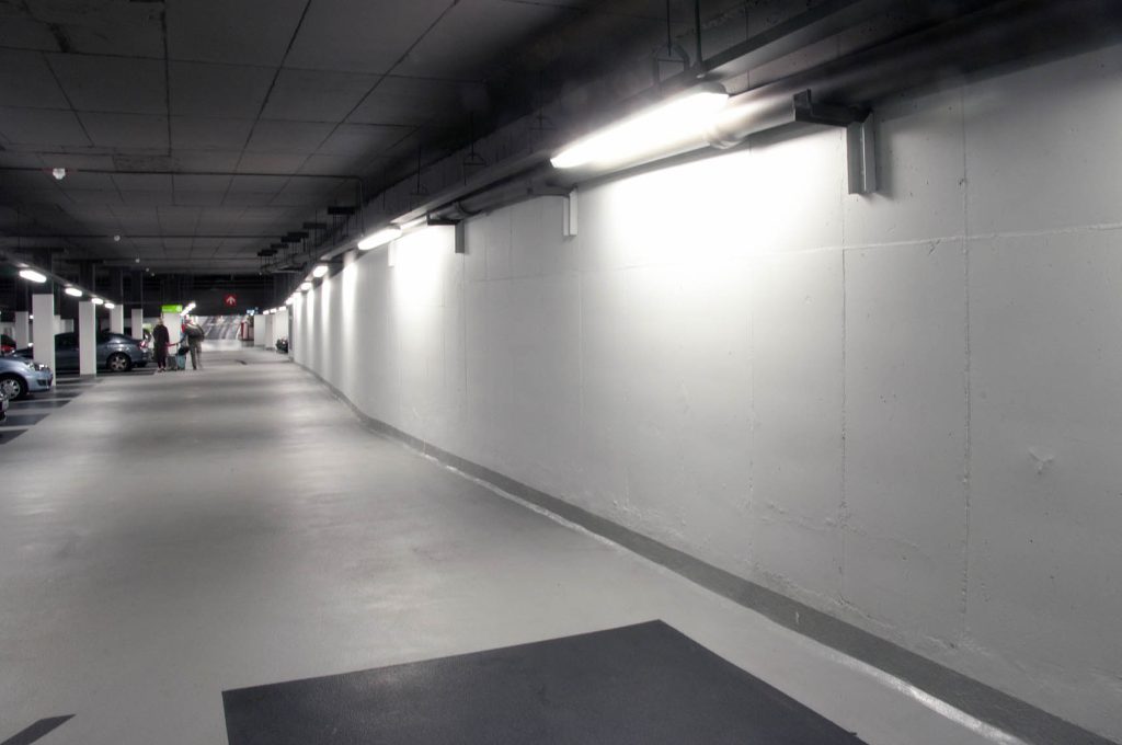 Smooth, continuous epoxy flooring across basement