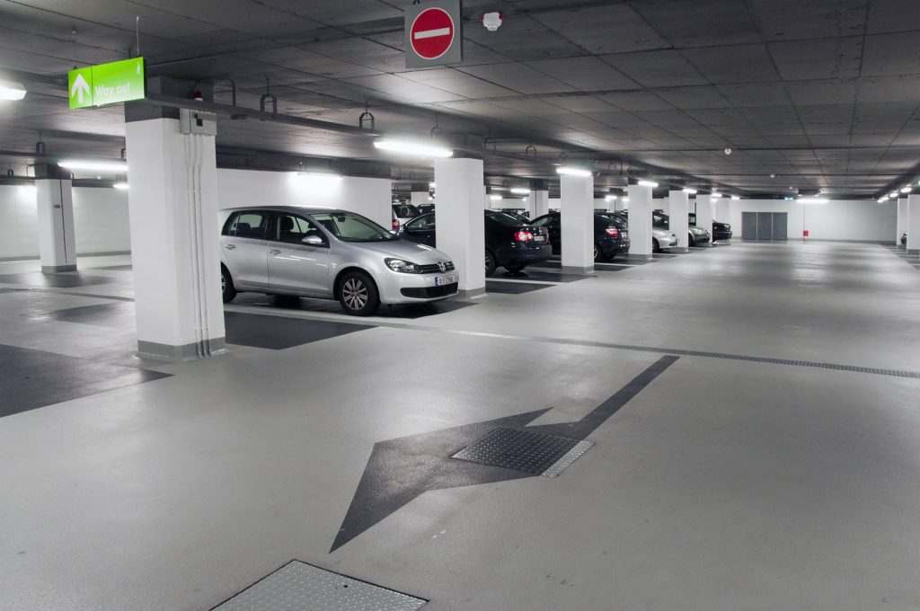 Renovated basement parking with high-quality epoxy flooring and protective coatings
