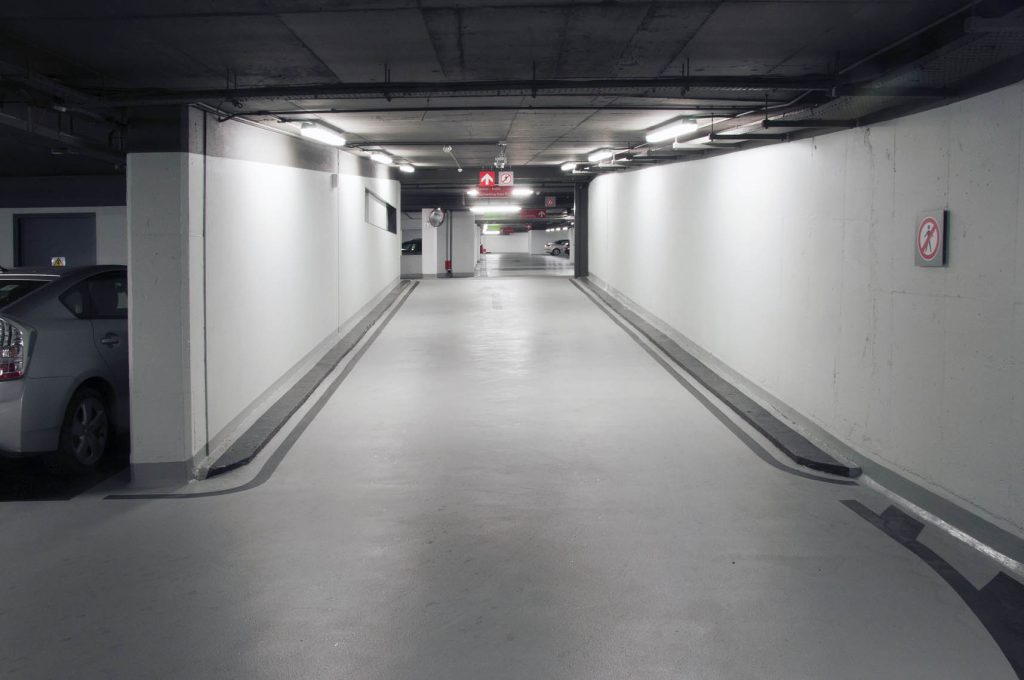 Basement parking with newly applied epoxy flooring