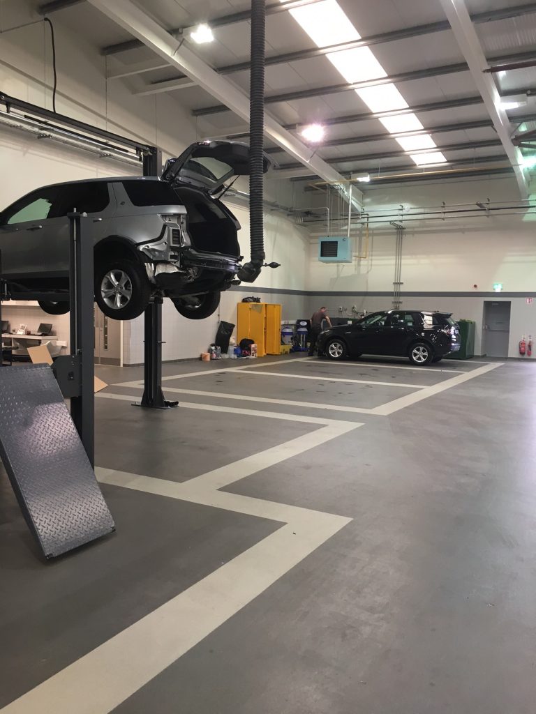 Smooth, durable epoxy flooring in industrial workshop