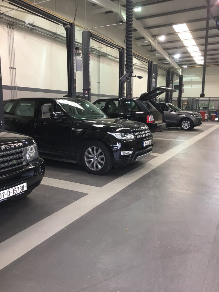 Epoxy flooring covering large workshop and showroom area