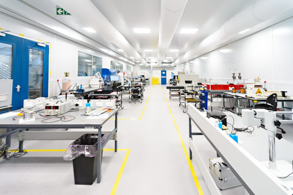 Empty high-tech scientific cleanroom with smooth, clean flooring